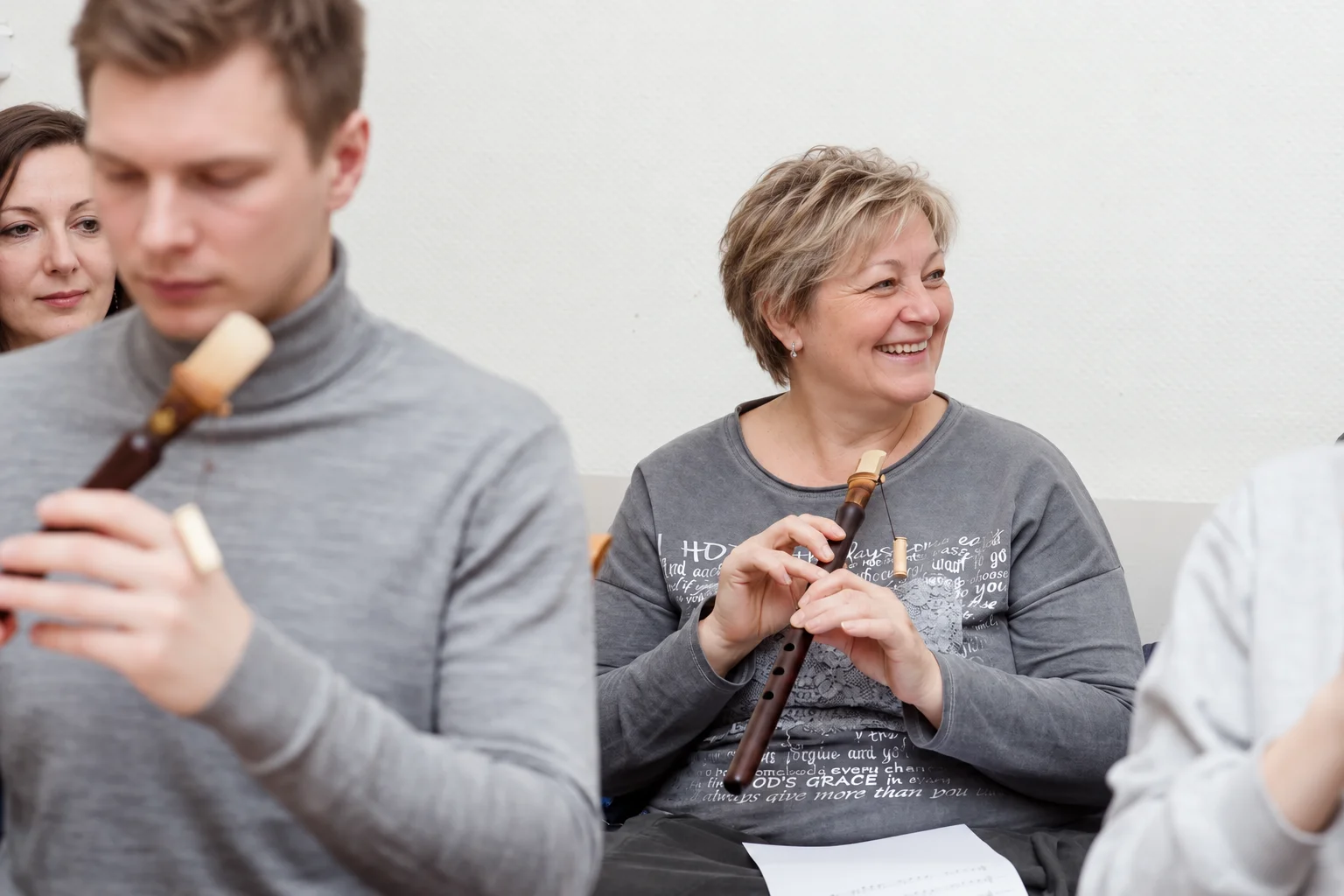 A workshop participant smiling with a duduk in her hands